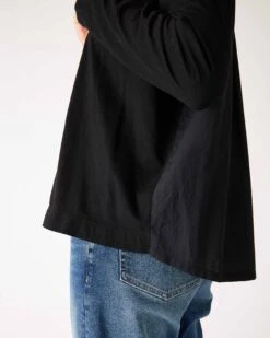 Moderne Pocket Crewneck Tee -Mersea womens black front pocket pleated back crew neck long sleeve tee side view high low waist detail