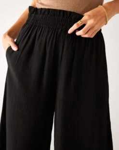Ibiza Pant 19 Ibiza Pant -Mersea womens black lightweight wide leg pant front view ruffle waist close up detail fringe