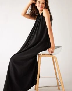 Patio Dress -Mersea womens black loose fit pullover maxi dress sitting side view