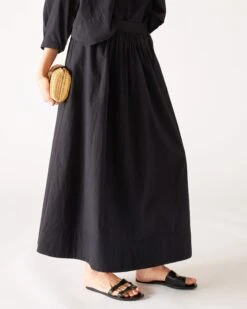 Sonnet Maxi Skirt -Mersea womens black maxi skirt side view purse