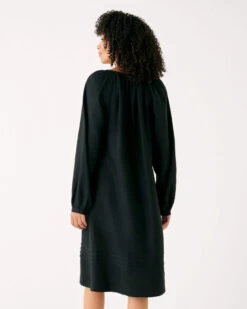 Fête Linen Dress -Mersea womens black summer lightweight relaxed fit tea length fete linen dress with v neck tassel ties and pintuck cuffs rear view