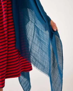 Nellie Wrap -Mersea womens blue breathable lightweight fringe hem multi functional nellie travel wrap close up