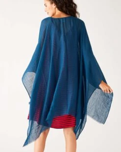 Nellie Wrap -Mersea womens blue breathable lightweight fringe hem multi functional nellie travel wrap rear view