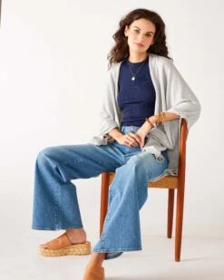 Nomad Relaxed Wide Leg Jean 7 Nomad Relaxed Wide Leg Jean -Mersea womens blue wash relaxed wide leg front view sitting