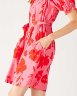 Ibiza Dress 25 Ibiza Dress -Mersea womens floral pink ruffled shoulder midi dress side view walking close up pocket detail