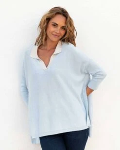 Catalina Polo Sweater 26 Catalina Polo Sweater -Mersea womens light blue heathered white collared v neck polo sweater front view hands behind back