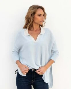 Catalina Polo Sweater 27 Catalina Polo Sweater -Mersea womens light blue heathered white collared v neck polo sweater front view tucked at waist