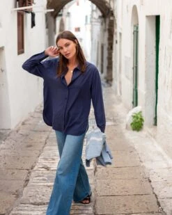 Brontë Relaxed Button Up Shirt 36 Brontë Relaxed Button Up Shirt -Mersea womens navy blue breathable relaxed fit button up shirt front view travel destination