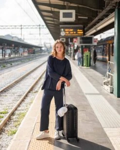 Traveler Tee Pant -Mersea womens navy blue wide leg ankle side slit elastic waist pant front view full body travel destination look