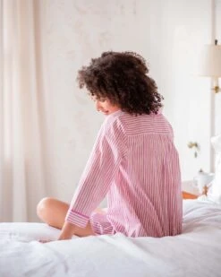 Over The Cotton Moon Nightshirt - Peony -Mersea womens pink yellow and white stripe full button front patch pocket curved bottom hem night shirt bed view