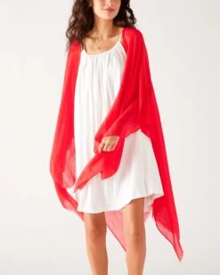 Nellie Wrap -Mersea womens red breathable lightweight fringe hem multi functional nellie travel wrap front view shoulder drape