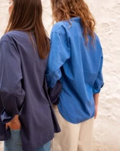 Brontë Relaxed Button Up Shirt 25 Brontë Relaxed Button Up Shirt -Mersea womens royal blue breathable relaxed fit button up rear view travel destination arms locked