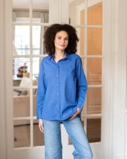 Brontë Relaxed Button Up Shirt 22 Brontë Relaxed Button Up Shirt -Mersea womens royal blue breathable relaxed fit button up shirt front view living room