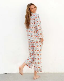 Over The Cotton Moon Pajama Set - Zinnias 8 Over The Cotton Moon Pajama Set - Zinnias -Mersea womens white blue orange zinnias print wide legged pajama set with pockets and ribbon tie rear view