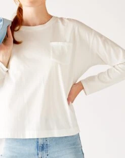 Moderne Pocket Crewneck Tee -Mersea womens white front pocket pleated back crew neck long sleeve tee front view pocket detail