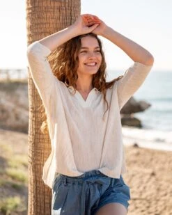 Catalina Polo Sweater 35 Catalina Polo Sweater -Mersea womens white heathered collared v neck polo sweater front view travel destination look hands on head