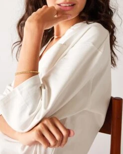 Amelia Tee Dress 9 Amelia Tee Dress -Mersea womens white midweight v neck drop shoulders amelia tee dress travel close up side view