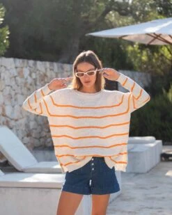 Camden Boatneck Sweater -Mersea womens white orange stripes midweight sweater standing travel destination look