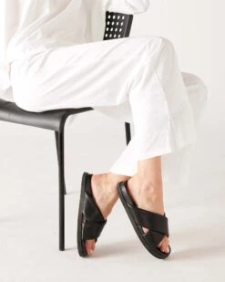 Traveler Tee Pant -Mersea womens white wide leg ankle side slit elastic waist pant sitting legs crossed knees bent