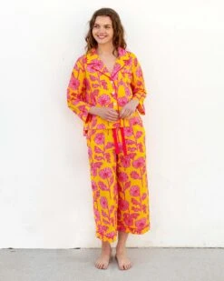 Over The Cotton Moon Pajama Set - Poppies 8 Over The Cotton Moon Pajama Set - Poppies -Mersea womens yellow pink poppy print wide legged pajama set with pockets and ribbon tie front view